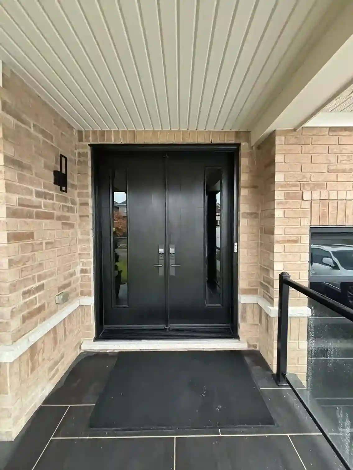 Black Double Entry Door with Narrow Glass Inserts and Lever Handles