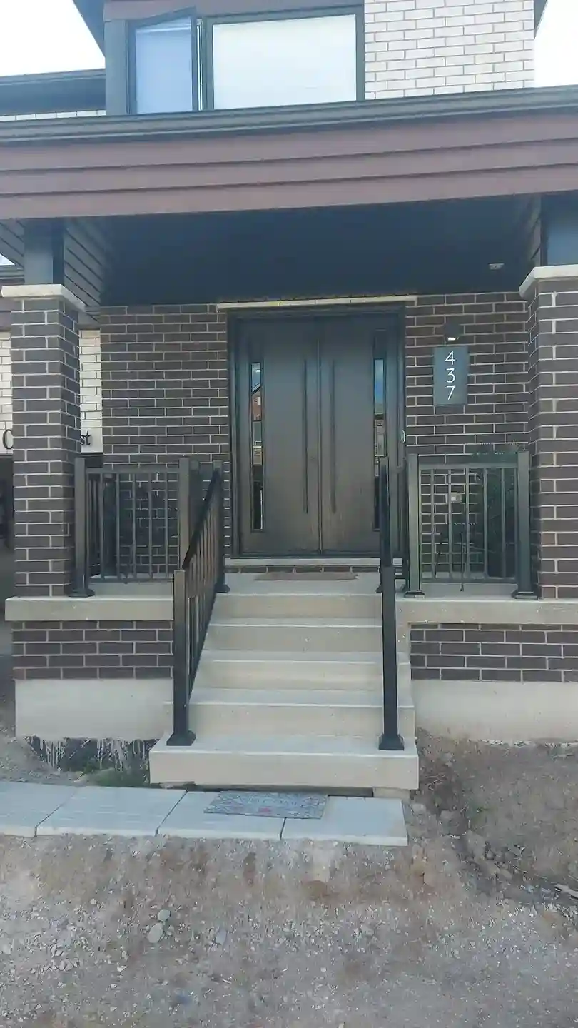 Wood-Grain Bronze Double Door with Vertical Glass Lites and Fluted Panels